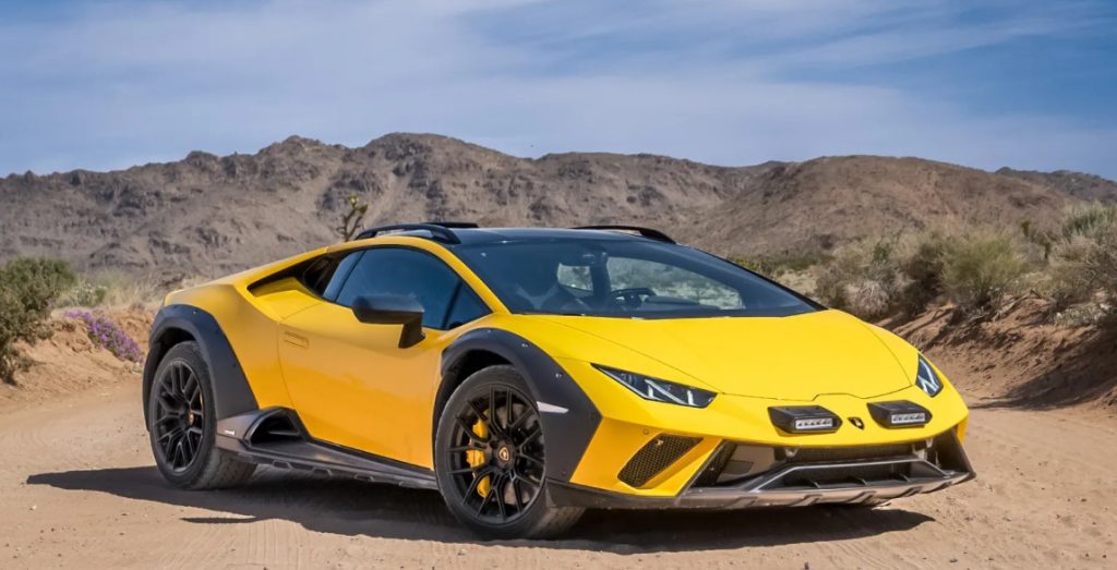 Yellow Lamborghini Huracan Sterrato parked off-road.